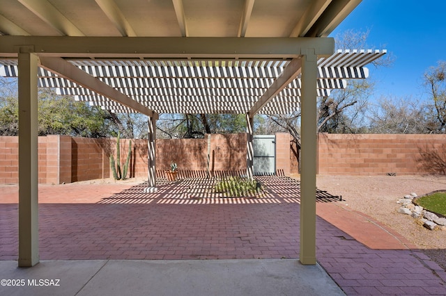 view of patio featuring a fenced backyard and a pergola