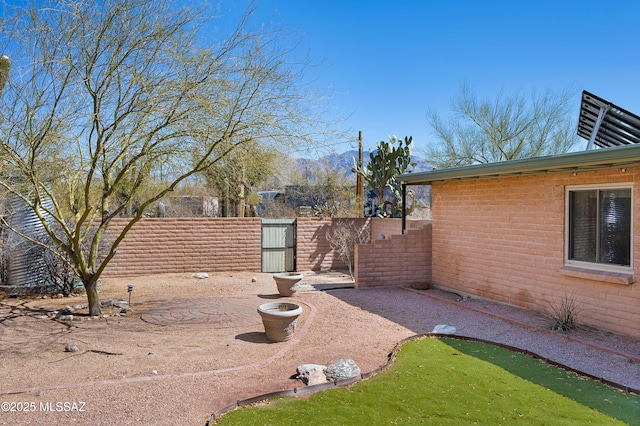 view of yard featuring a gate and fence