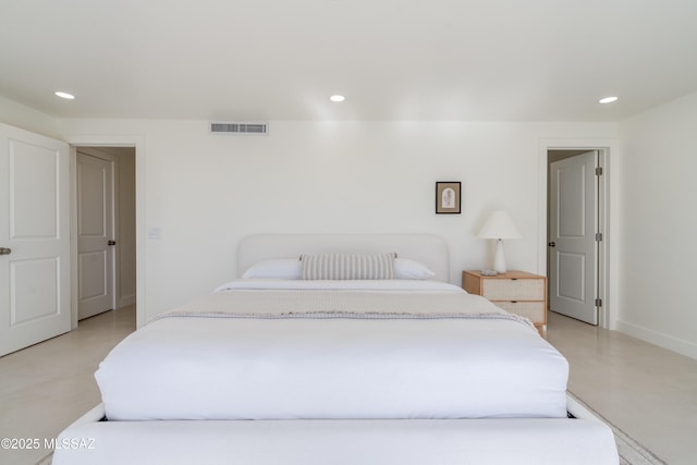 bedroom with finished concrete flooring, baseboards, visible vents, and recessed lighting