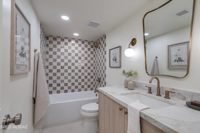 bathroom featuring toilet, bathtub / shower combination, visible vents, and vanity