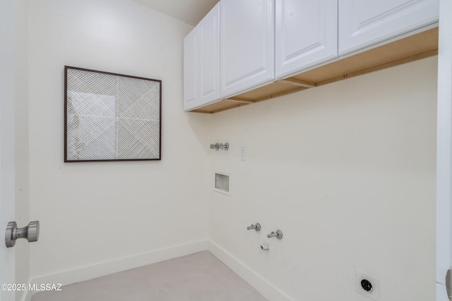 clothes washing area with cabinet space, baseboards, gas dryer hookup, washer hookup, and electric dryer hookup