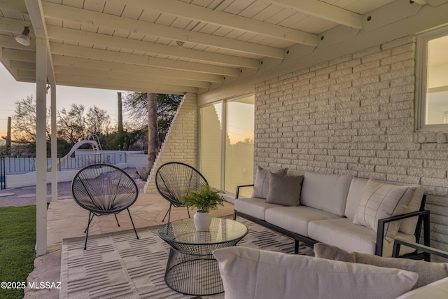 view of patio / terrace featuring an outdoor hangout area and fence