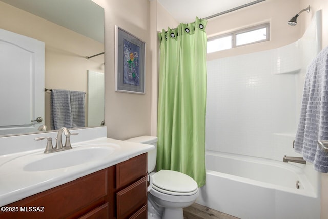 full bath featuring shower / bath combination with curtain, vanity, and toilet