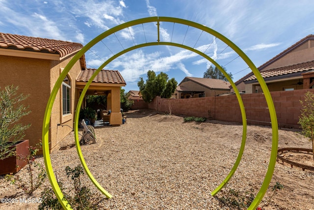 view of yard featuring a patio and a fenced backyard