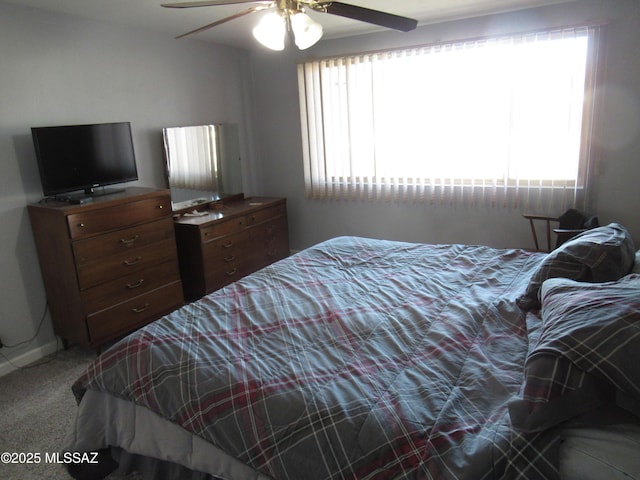 bedroom with carpet floors and a ceiling fan