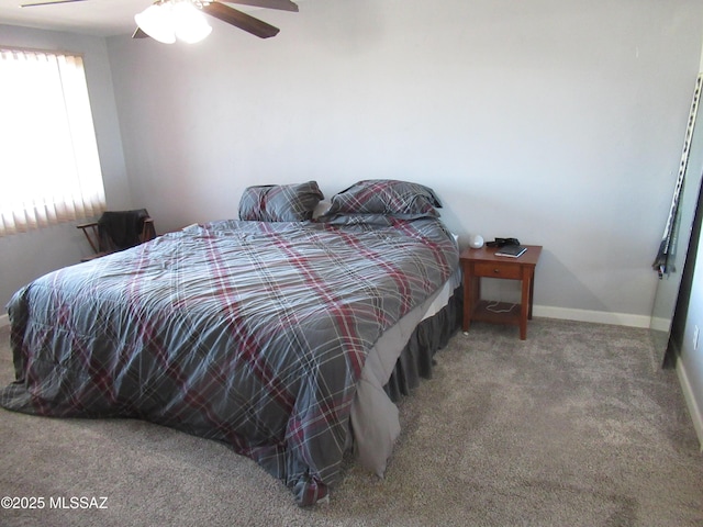 bedroom with carpet floors, ceiling fan, and baseboards