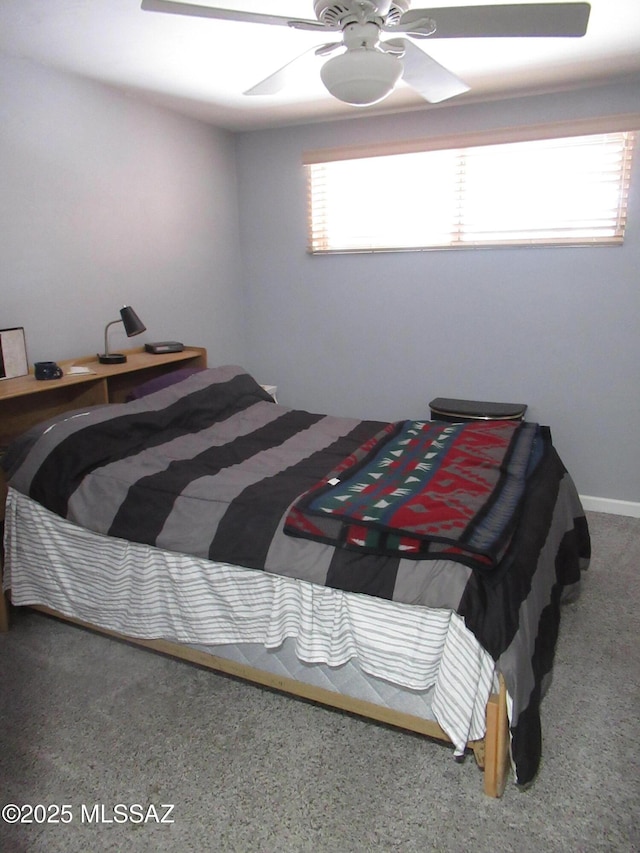 carpeted bedroom with a ceiling fan