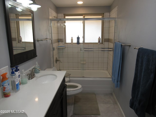 full bathroom featuring baseboards, toilet, enclosed tub / shower combo, tile patterned flooring, and vanity