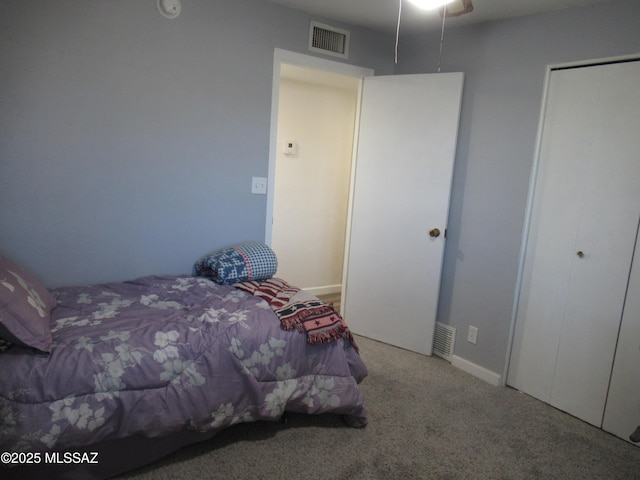 unfurnished bedroom featuring carpet and visible vents