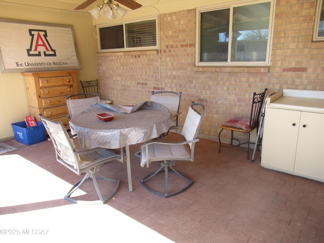 view of patio / terrace featuring outdoor dining area and ceiling fan