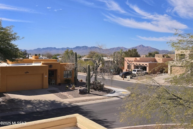 view of street with curbs and a mountain view