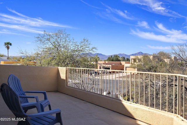 balcony featuring a mountain view