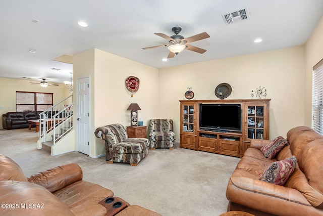 living area with recessed lighting, light colored carpet, visible vents, stairway, and a ceiling fan