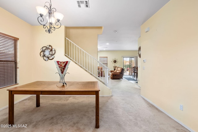 13076 N Desert Olive Dr, Oro Valley, AZ 85755 - carpeted entrance foyer with visible vents, baseboards, a chandelier, and stairs