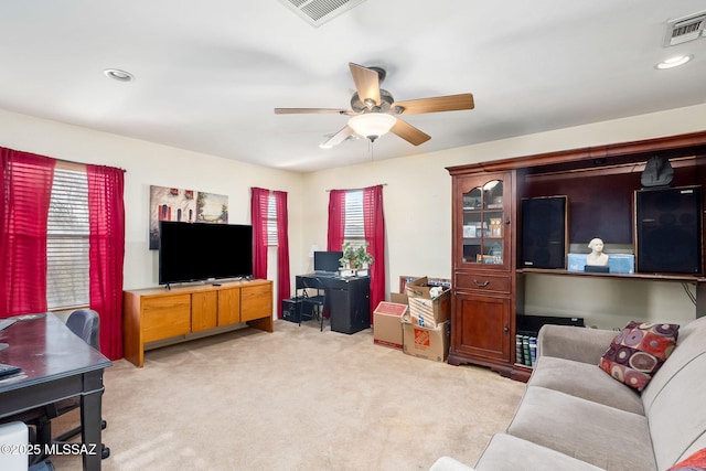 13076 N Desert Olive Dr, Oro Valley, AZ 85755 - living area with a healthy amount of sunlight, ceiling fan, and visible vents