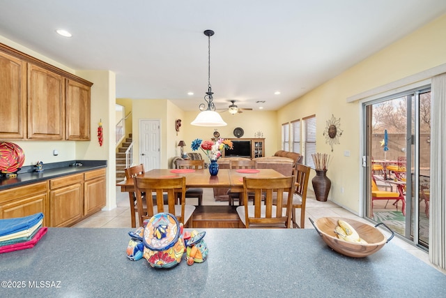 dining area featuring recessed lighting, stairway, and light tile patterned floors