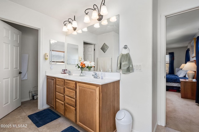 13076 N Desert Olive Dr, Oro Valley, AZ 85755 - full bath with double vanity, a sink, tile patterned flooring, and connected bathroom