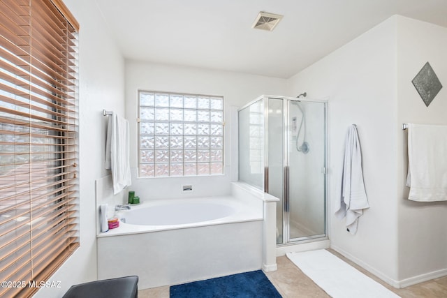 full bathroom with a bath, a stall shower, visible vents, and tile patterned floors