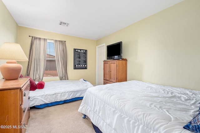 carpeted bedroom with visible vents