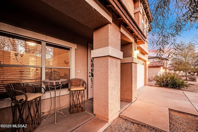 view of patio featuring a garage