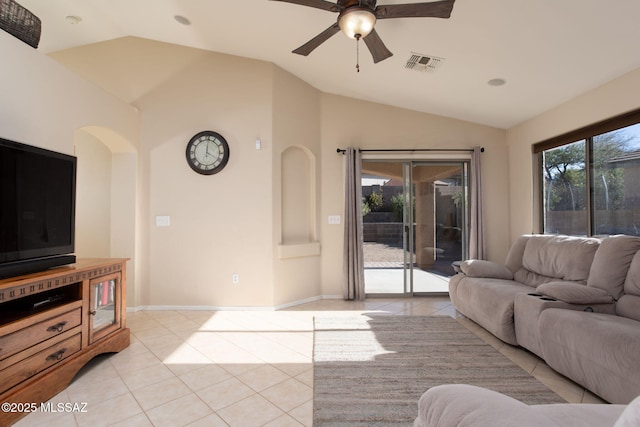 living area with light tile patterned floors, ceiling fan, visible vents, and vaulted ceiling