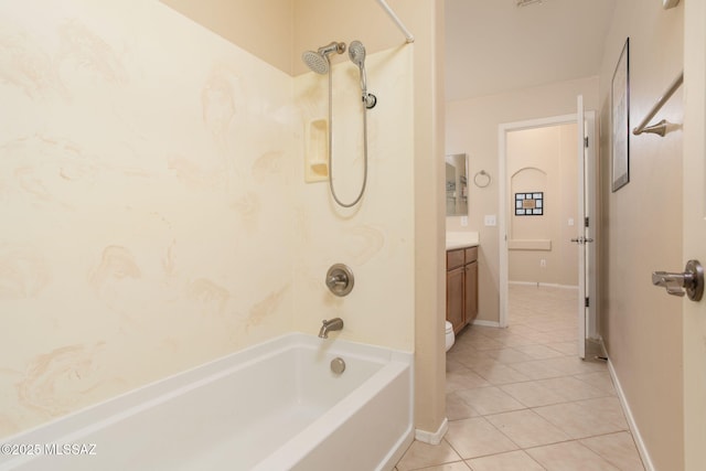 bathroom featuring shower / washtub combination, tile patterned flooring, vanity, and baseboards