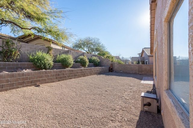 view of yard with a fenced backyard