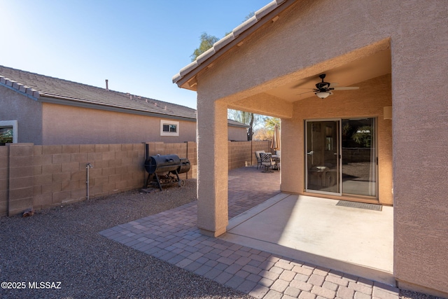 view of patio with ceiling fan and a fenced backyard