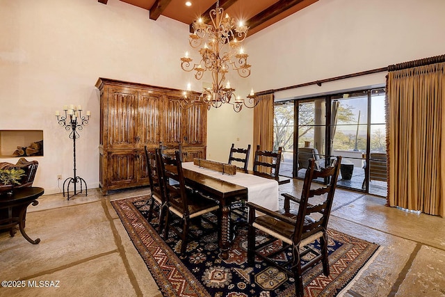 dining space with a chandelier, a high ceiling, beam ceiling, and baseboards