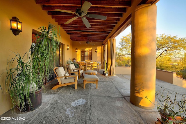 view of patio with ceiling fan and outdoor dining space