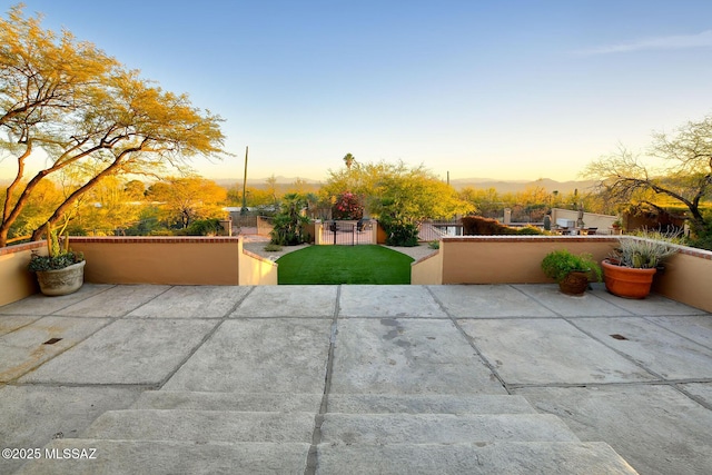 view of patio featuring fence