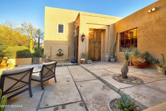 view of patio / terrace featuring exterior fireplace