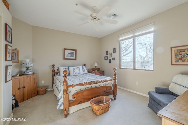 bedroom with a ceiling fan, carpet flooring, visible vents, and baseboards