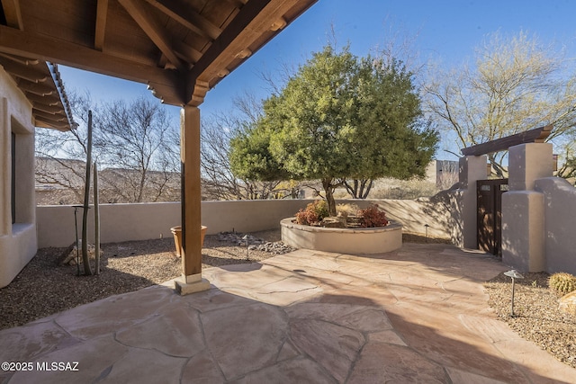 view of patio / terrace with a gate and fence