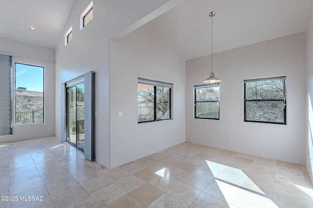 spare room with a towering ceiling