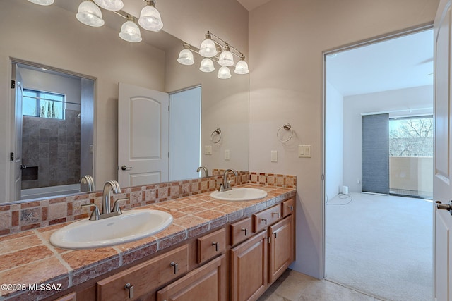 full bath with double vanity and a sink