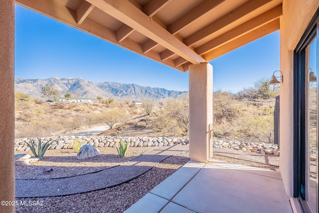 view of patio / terrace featuring a mountain view