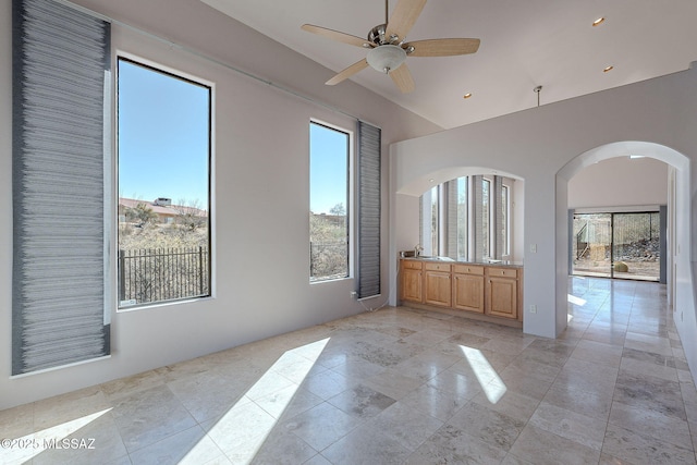 spare room with a ceiling fan and recessed lighting