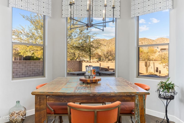 dining space featuring baseboards and a wealth of natural light