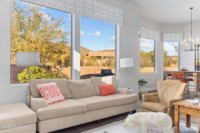 sunroom / solarium with an inviting chandelier