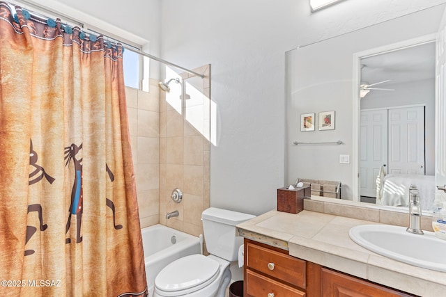 full bathroom featuring toilet, shower / tub combo, vanity, a ceiling fan, and ensuite bath