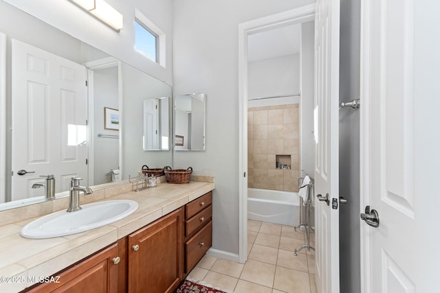 full bath featuring  shower combination, vanity, and tile patterned floors