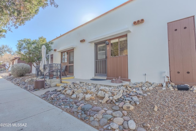 exterior space with stucco siding