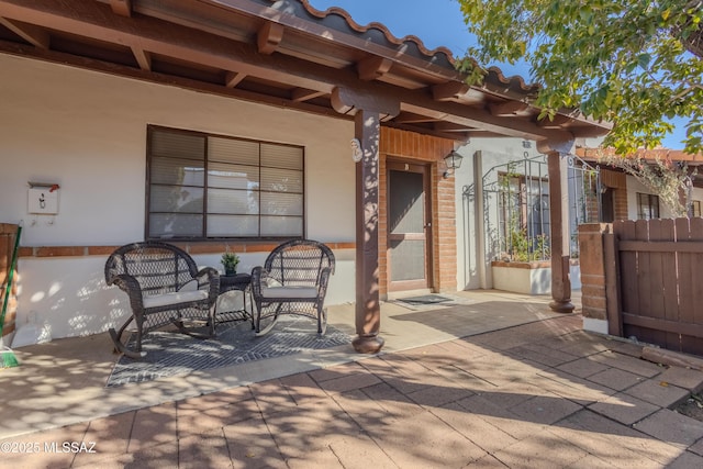 view of patio / terrace featuring fence