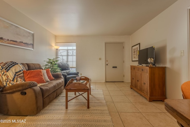 living area featuring light tile patterned flooring