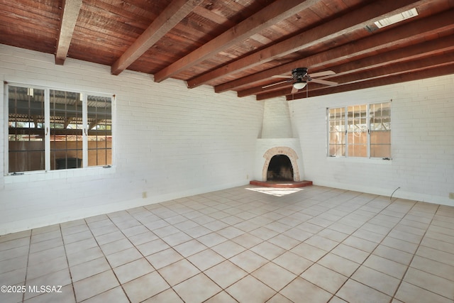 view of patio featuring a ceiling fan and a fireplace