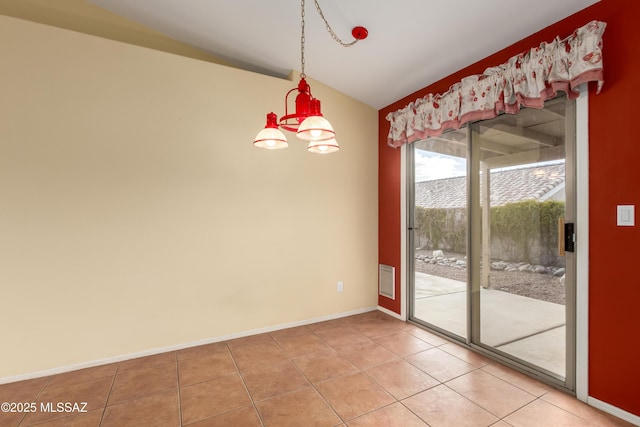 spare room featuring light tile patterned floors, baseboards, and vaulted ceiling