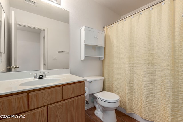 full bath with tile patterned flooring, visible vents, vanity, and toilet