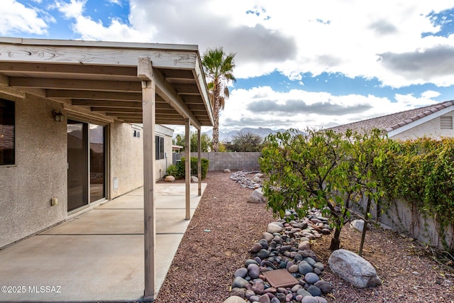 view of yard with a fenced backyard and a patio