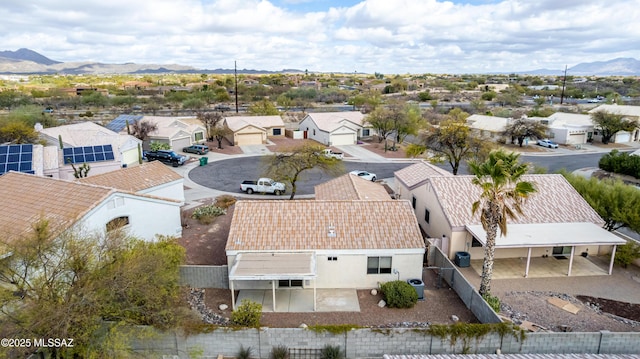 drone / aerial view featuring a residential view and a mountain view